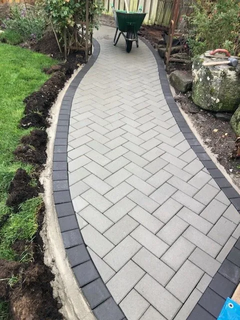 The same garden path further along, edges cut in