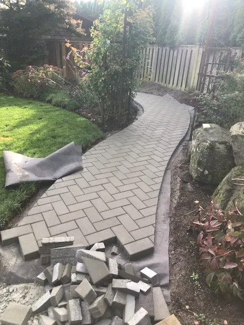 Garden path partway through, base in and pavers going down