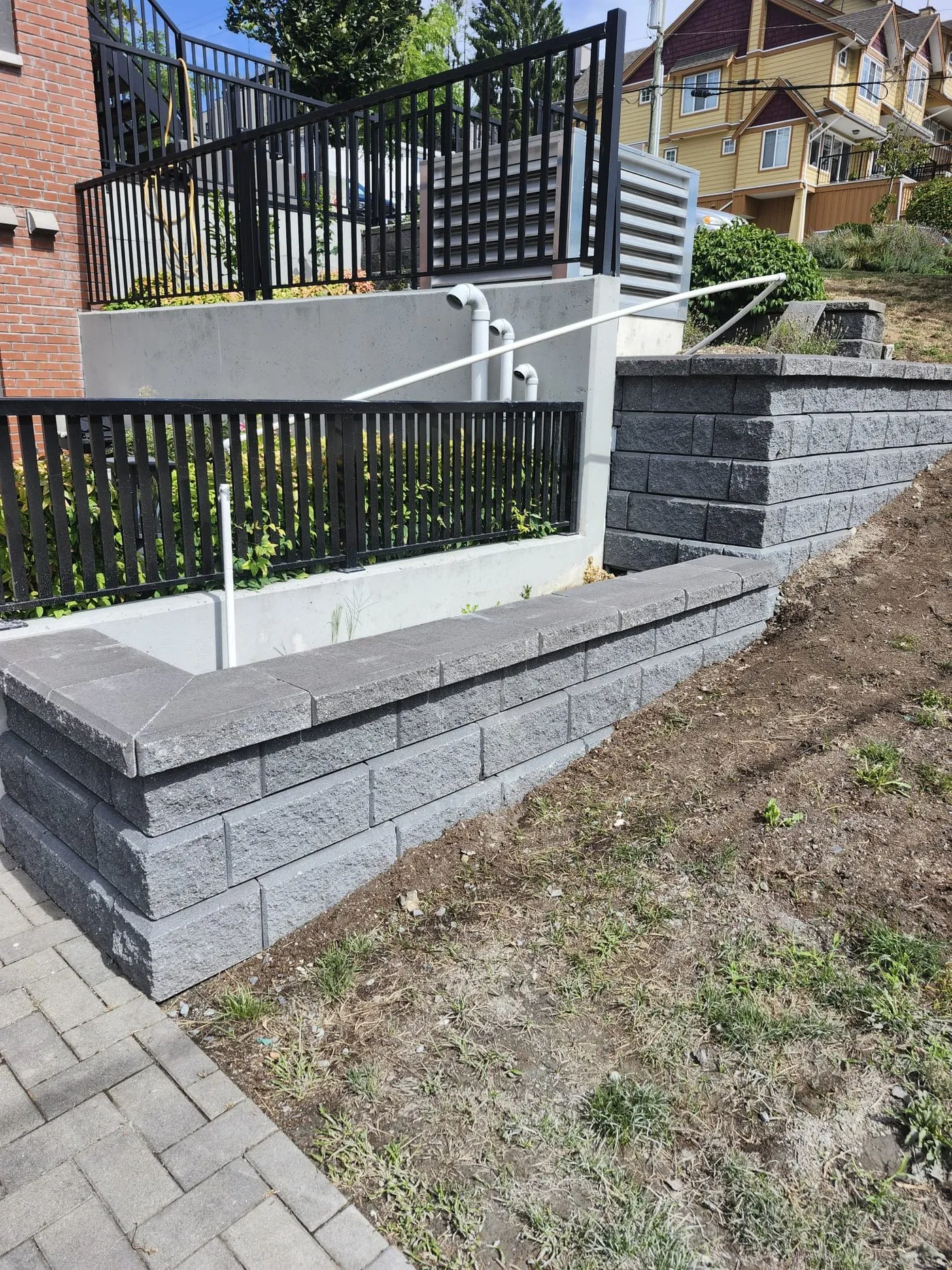 After: small yard wall along the walk
