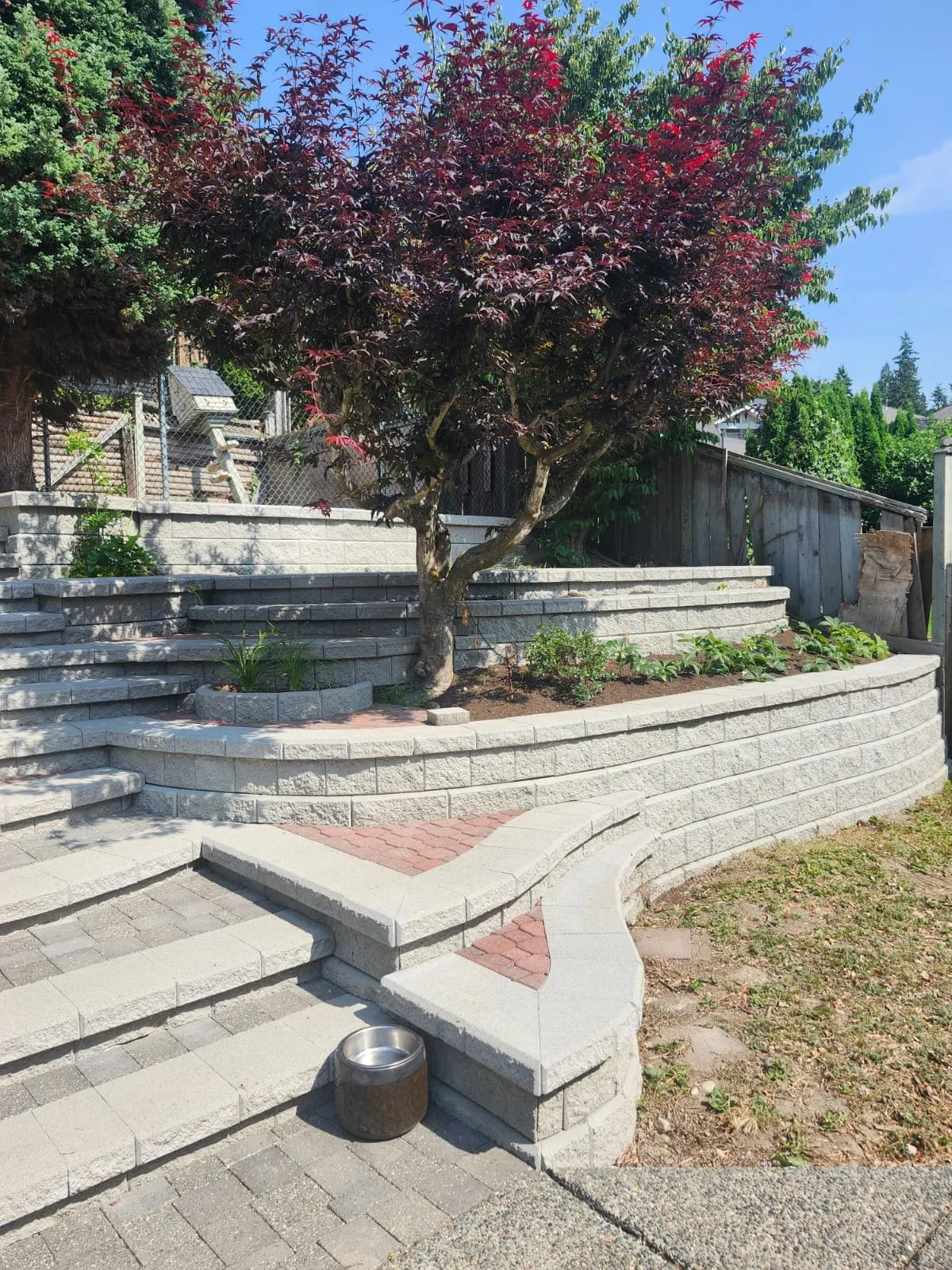 After: tiered walls and paver steps